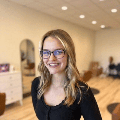 Portrait of Gracee, a professional stylist at Sisu Hair Studio, showcasing their expertise and style.