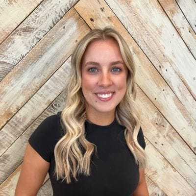 Portrait of Olivia, a professional stylist at Sisu Hair Studio, showcasing their expertise and style.