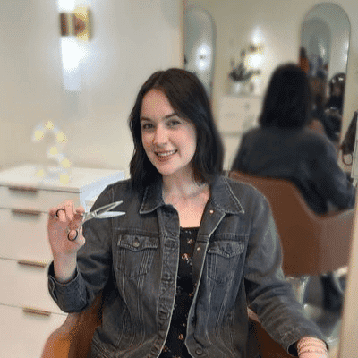 Portrait of Courtney, a professional stylist at Sisu Hair Studio, showcasing their expertise and style.