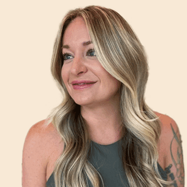Portrait of Brittany, a professional stylist at Sisu Hair Studio, showcasing their expertise and style.
