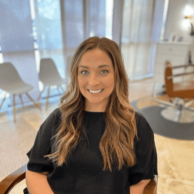Portrait of Amanda, a professional stylist at Sisu Hair Studio, showcasing their expertise and style.
