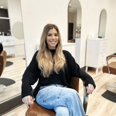 Portrait of Allie, a professional stylist at Sisu Hair Studio, showcasing their expertise and style.